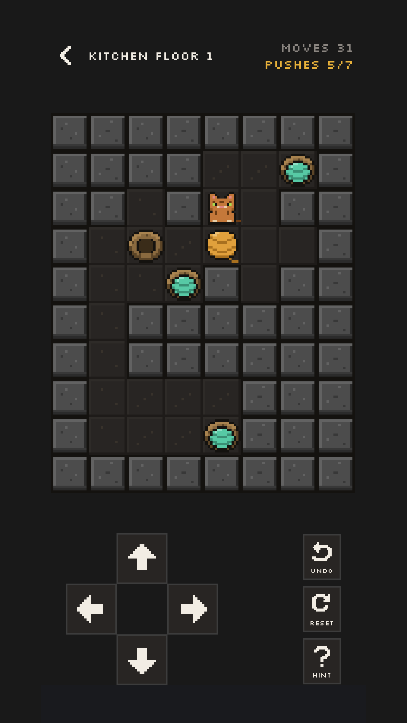 A Catoban puzzle mid-solve, with some yarn balls settled in baskets